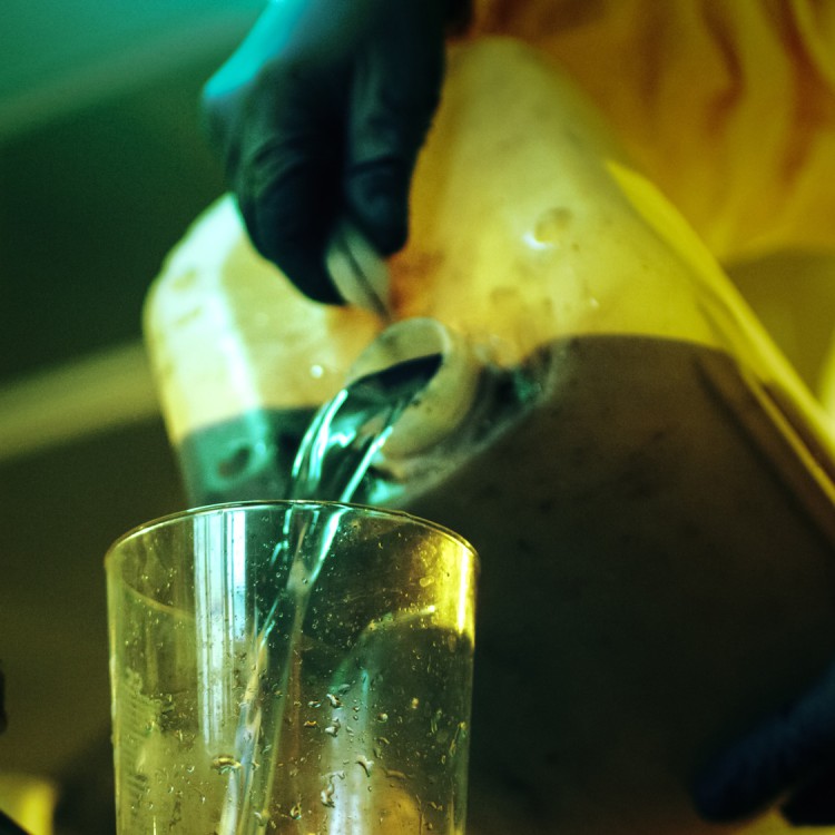 man-pouring-chemicals.jpg